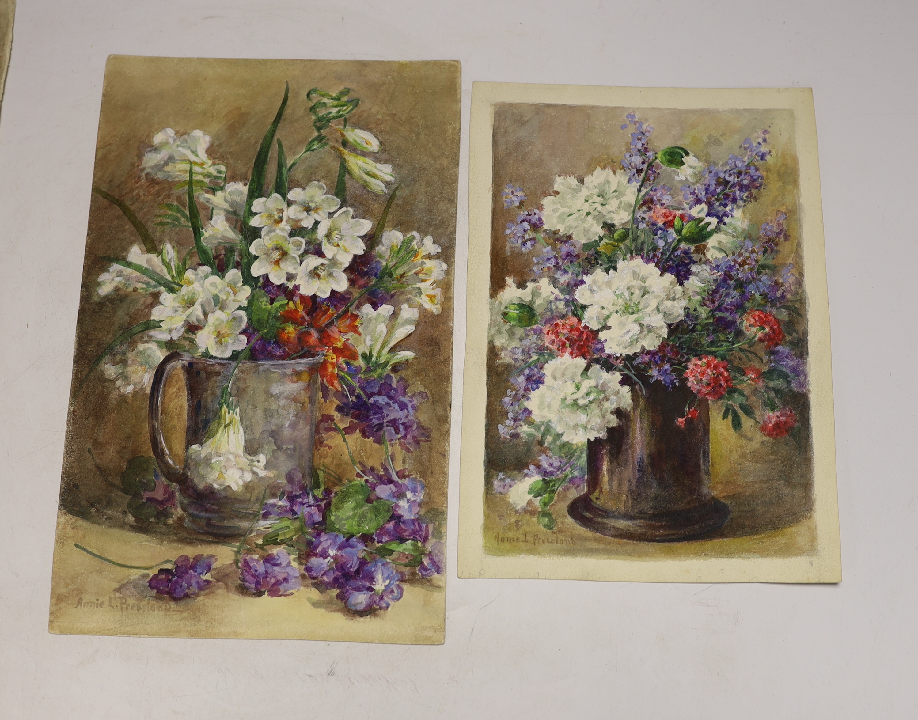 Annie L. Pressland (1862-1933) four watercolours on card, ‘Primulas’, ‘Nasturtiums’, ‘White Pinks & Catmint’ & ‘Freesias & Parma Violets’, each signed, unframed, 28 x 18cm